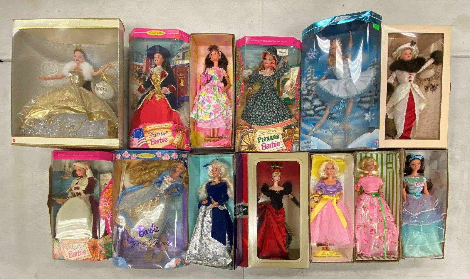 Group of Assorted Mattel Barbie Fashion Dolls: Includes various dolls, some damage to boxes, each doll measures 11 1/2” H