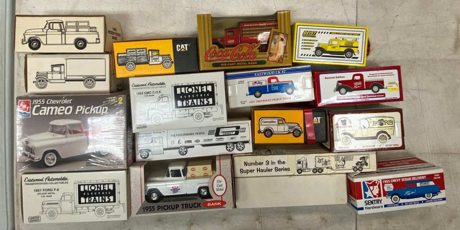 Group of Die-Cast Vehicles Coin Banks and More: Includes trucks, semis with trailers, cameo pickup and more, in original boxes, largest is 1/25 scale