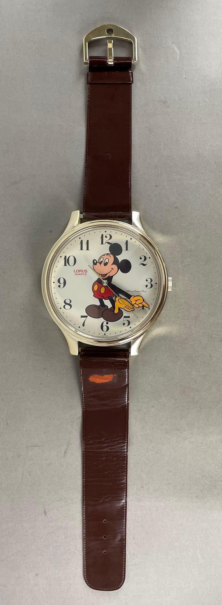 Walt Disney Lorus Quartz Mickey Mouse Watch Wall Clock: Working condition, missing battery cover, measures H 32 1/2" x W 7 1/2" x D 1 1/2"