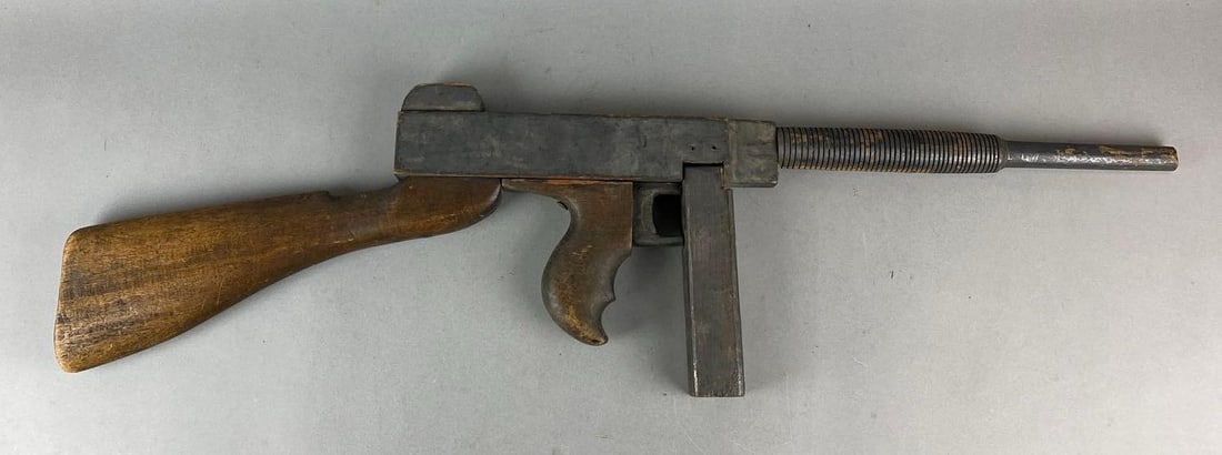Screen Used Thompson Machine Gun Wood Prop: Has wear. Measures H 8 1/2 x W 35 x D 2 inches.