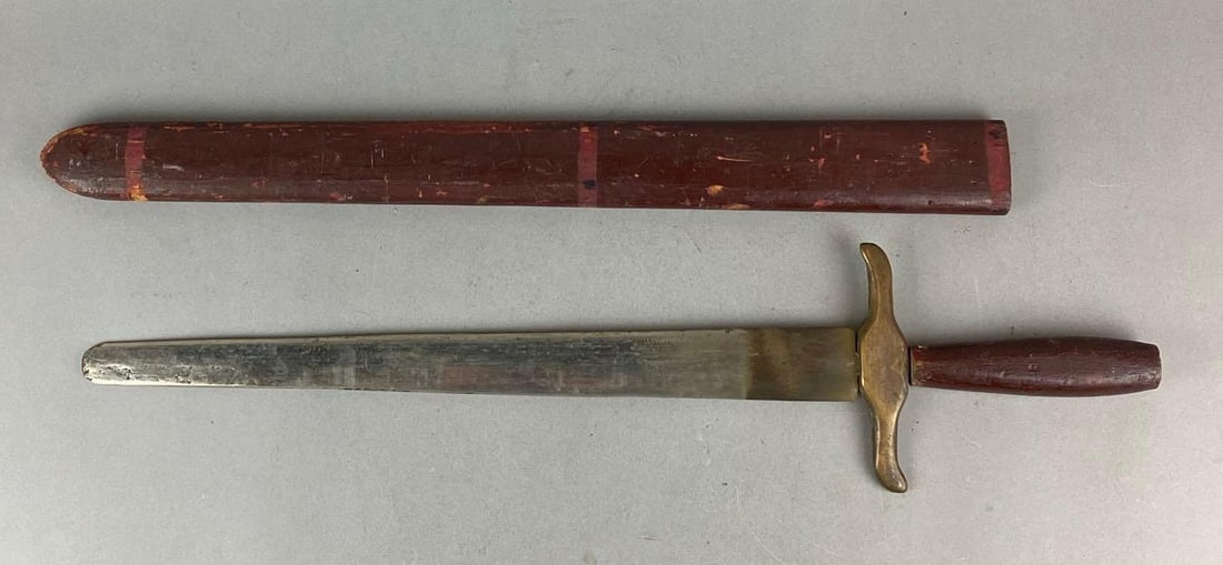 Screen Used Sword and Sheath Wood and Metal Prop: Used in 1957 The Story of Mankind and 1951 The Tales of Robinhood. Sword measures H 6 x W 26 x D 1 1/4 inches.