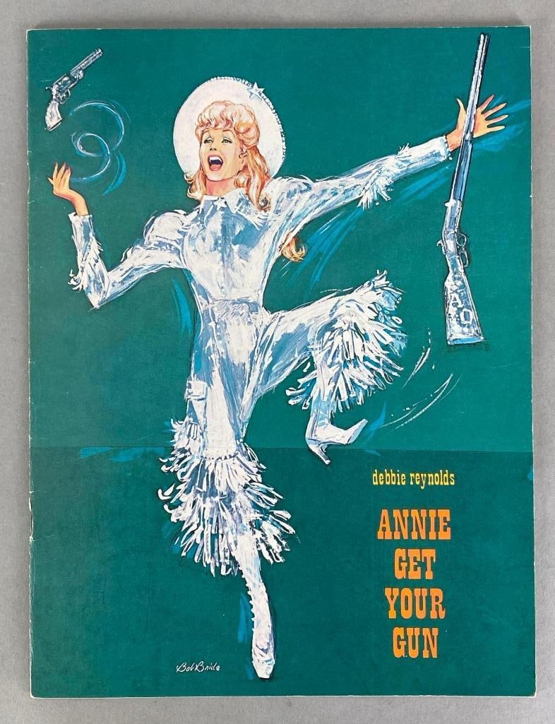 1977 Annie Get Your Gun Signed Program: Includes signatures from Debby Reynolds, Harve Presnell, Gavin MacLeod, Bobbi Osterwald, Art Lund, Don Potter, and Manu Tupou, Measures 12 x 9 inches.