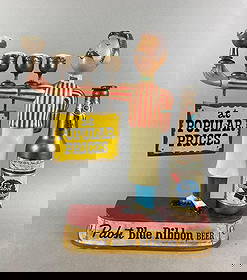 Vintage Pabst Blue Ribbon Advertising Back Bar Metal Statue: Has been repainted in spots has chips in paint. Measures H 14 3/4 x W 12 x D 3 1/2 inches.