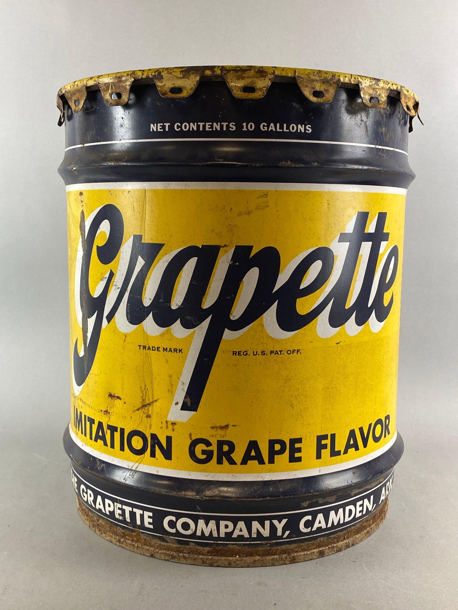 Vintage Grapette Company Advertising 10 Gallon Drum: Bottom and lid have rust. Measures H 17 x W 14 1/2 x D 14 1/2 inches.