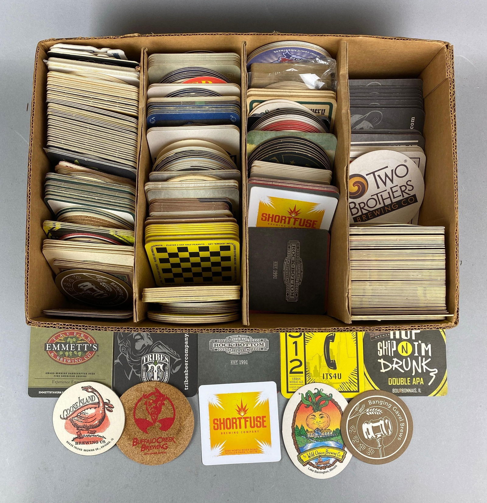 Large Group of Assorted Advertising Beer Coasters: Includes brands Shortfuse, Goose Island and more. Box measures H5 xW 17 1/2 x D12 1/2 inches.