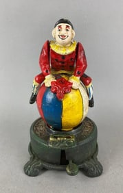 Reproduction Clown on Globe Cast Iron Bank