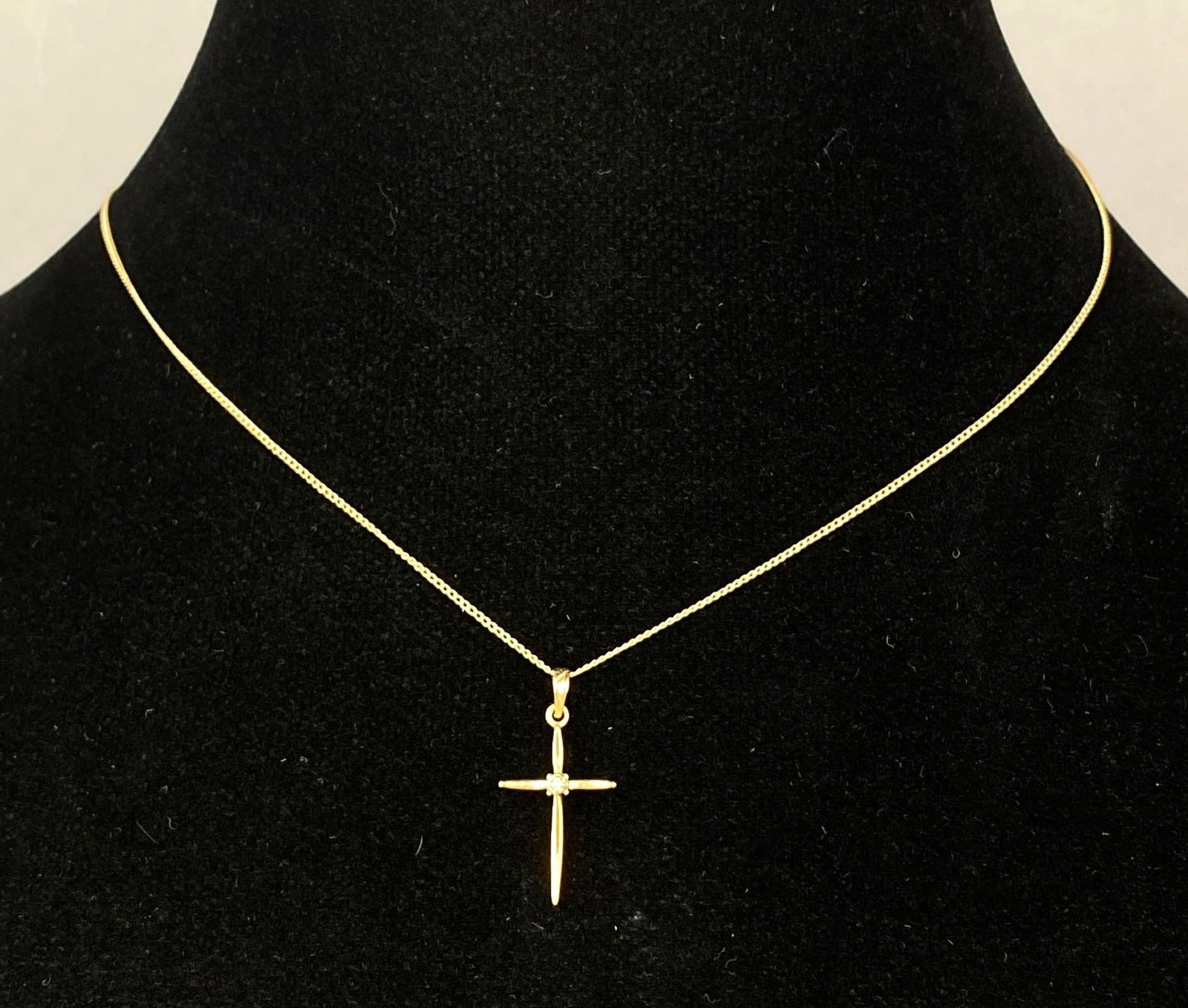 Signed Esemko Diamond Cross 14k Gold Necklace: Total weight 1.3 Grams. Chain measures 15 inches in length.