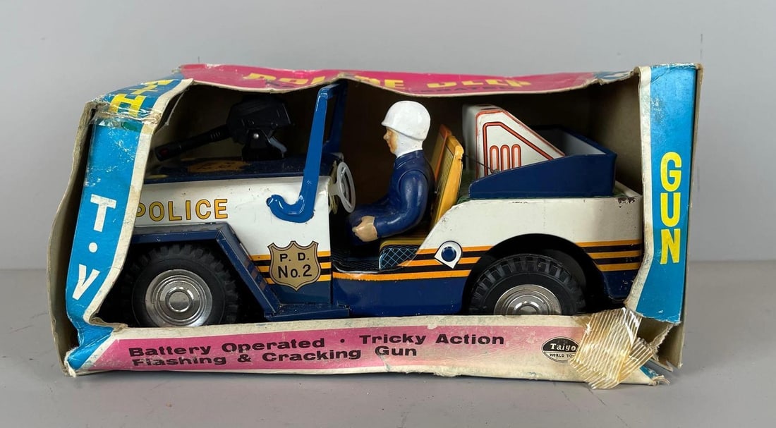 Vintage Taiyo Tin Litho Battery Operated Police Jeep: Gun only lit in test, original box measures H 5 1/4" x W 10" x D 5 1/4"