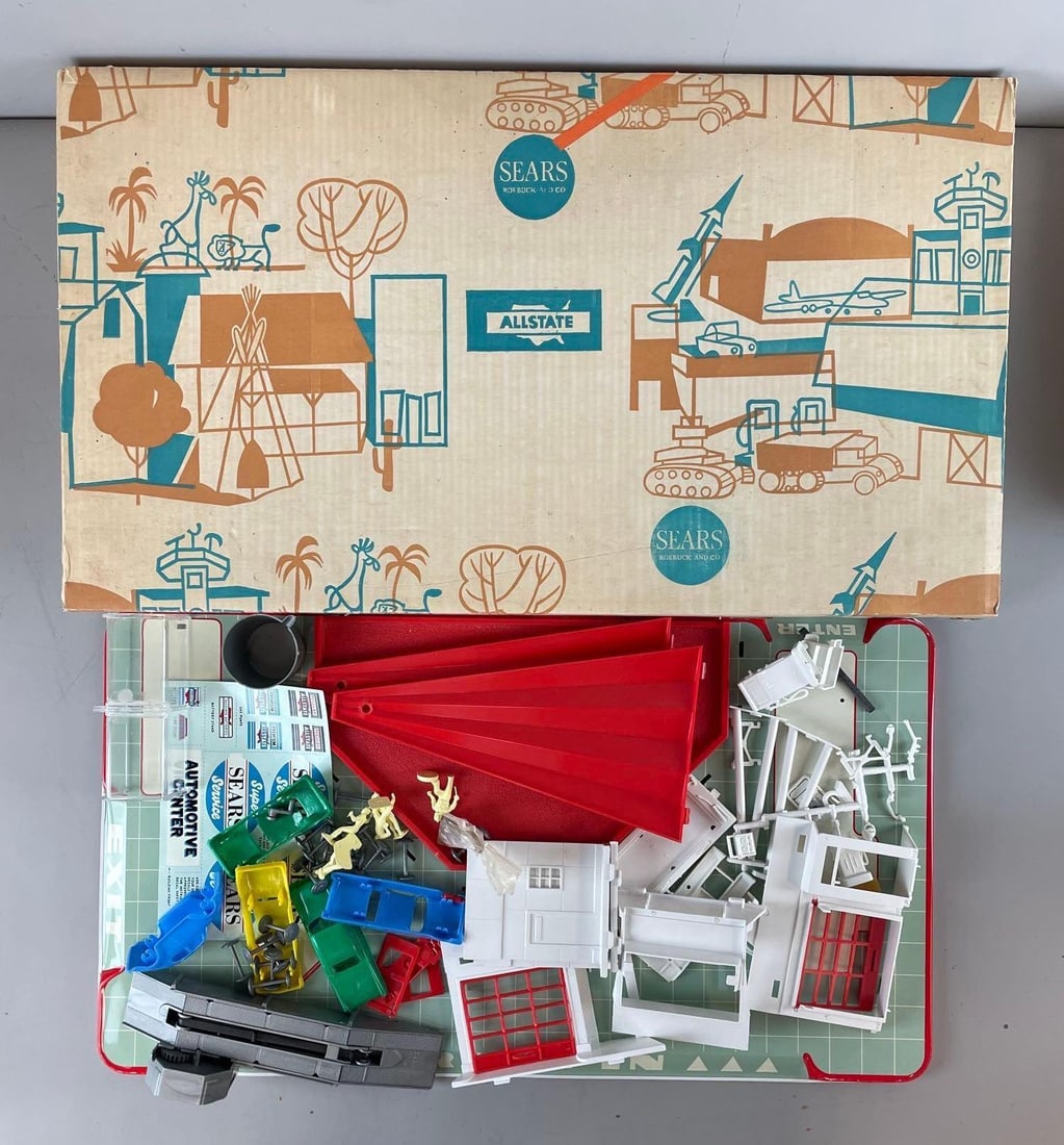 Vintage Sears Allstate Tin Litho / Plastic Automotive Center Playset: Appears complete with decals, original box measures H 15 1/4" x W 27" x D 3 1/4"