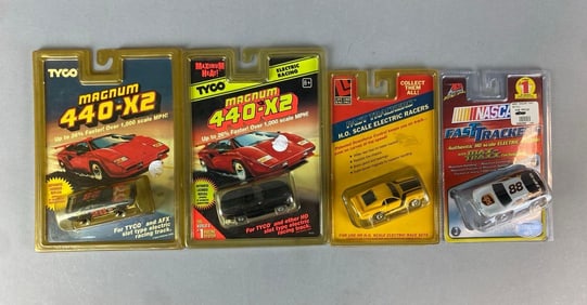 Group of 4 HO Scale Slot Cars