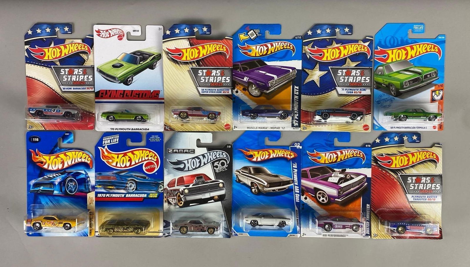 Group of 12 Hot Wheels Plymouth Duster and Barracuda Die-Cast Vehicles: Set of 12 Plymouth dusters and Barracudas Hot Wheels die-cast cars, new in packaging.