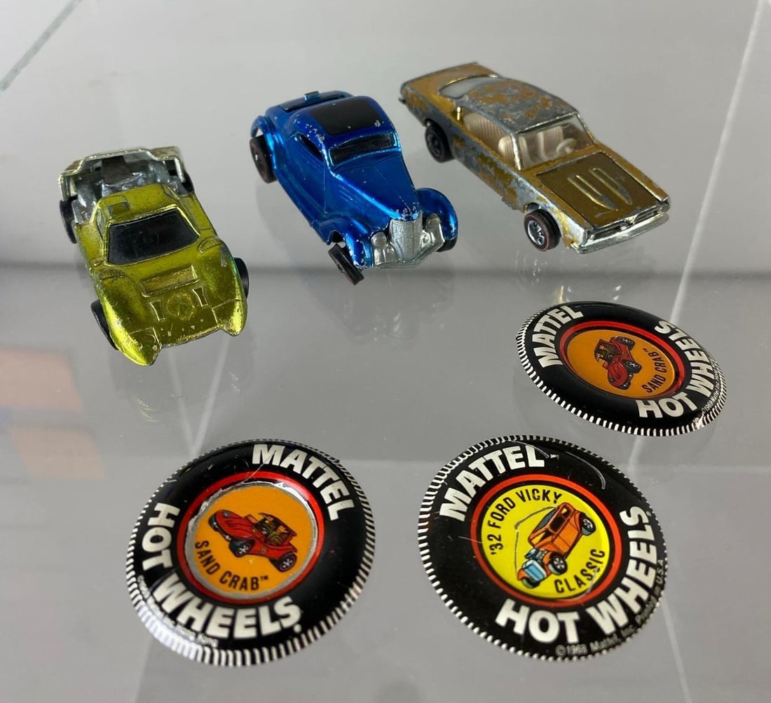 various vintage Hot Wheels: Various Ford J car, 36 Ford Coupe, Barracuda, and buttons. J car has broken hinge and axle.