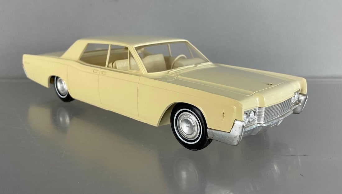 1966 Lincoln Continental 4 Door Sedan Dealership Promo Car: Arctic white, coaster, discolored passenger side, missing hood ornament