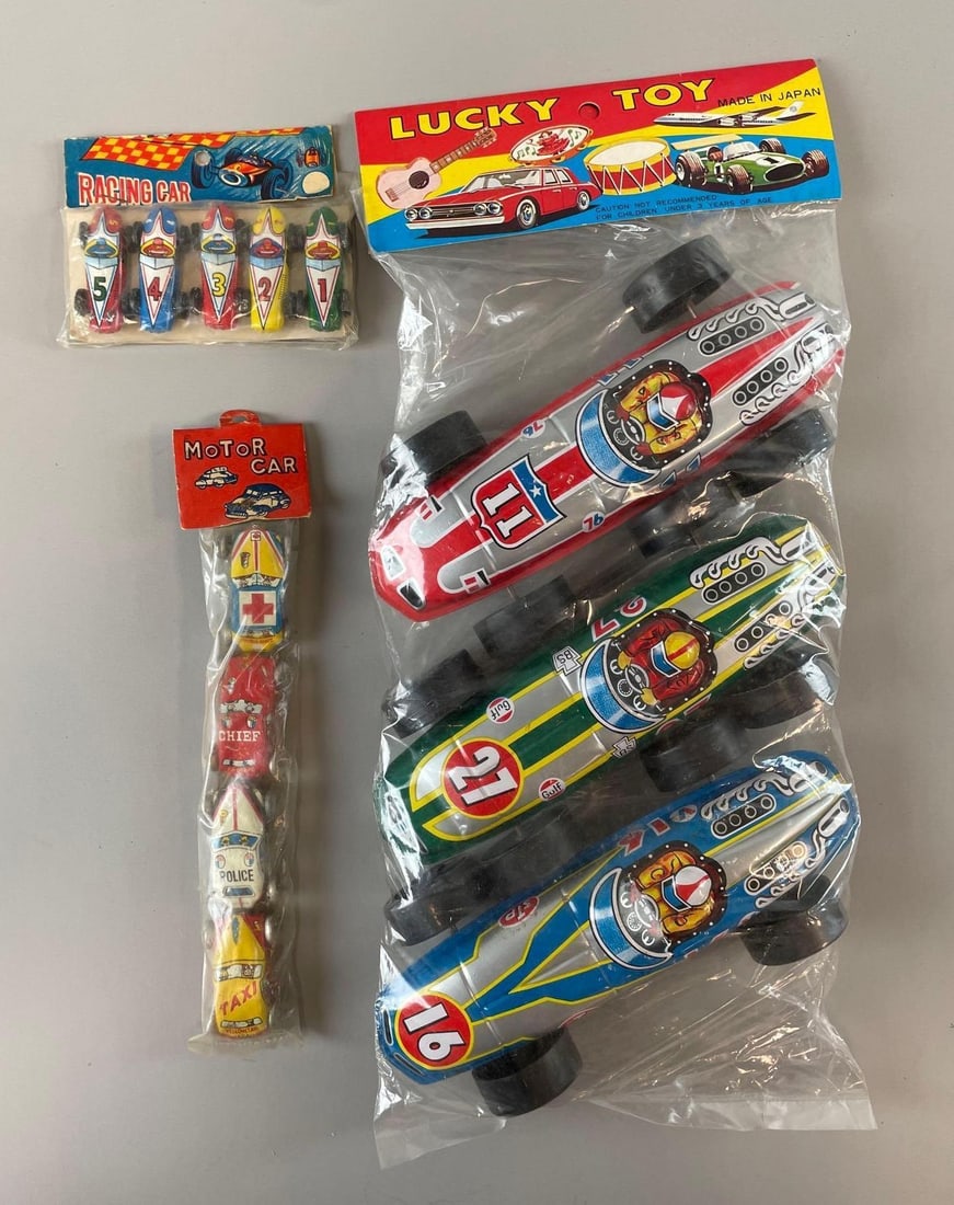 Group of Vintage Japanese Tin Litho Racing Cars: Largest original packaging measures H 14" x W 6"