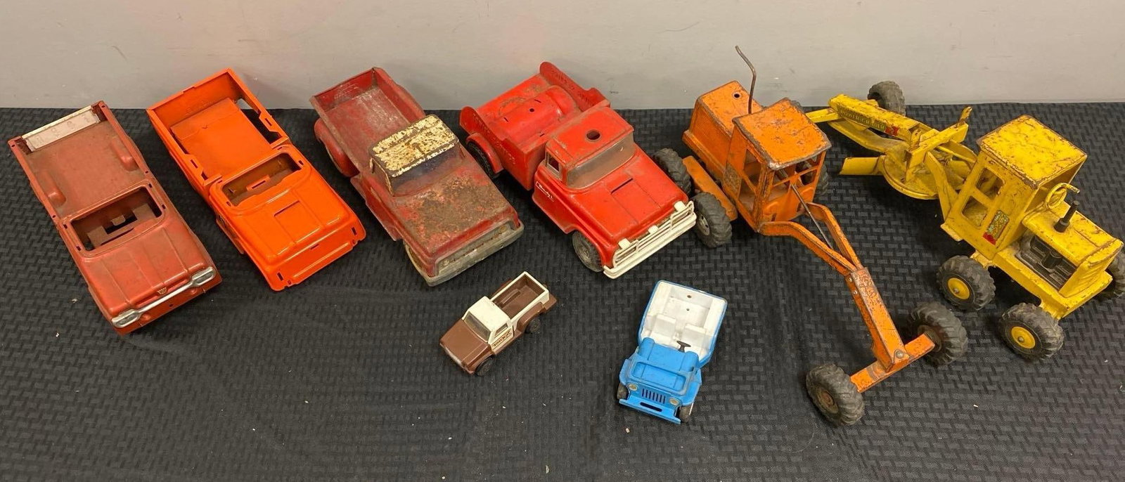 Group of Assorted Press Steel Vehicles: Trucks, cars, and tractors.