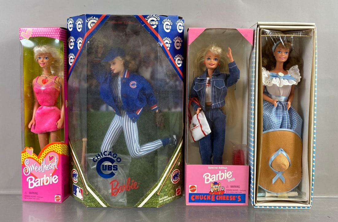 Group of 4 Mattel Barbie Fashion Dolls: Includes sweetheart, Chicago Cubs, and more. Mild wear throughout. New in packaging l. Circa 90’s