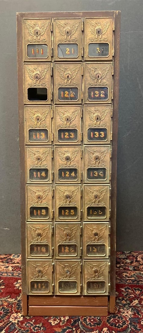Antique Post Office Box Cabinet: No in-house shipping available, 3rd party shipper recommended. 21 cubbies, one glass pane missing, another cracked, measures H 41 3/4" x W 12 1/2" x D 14"
