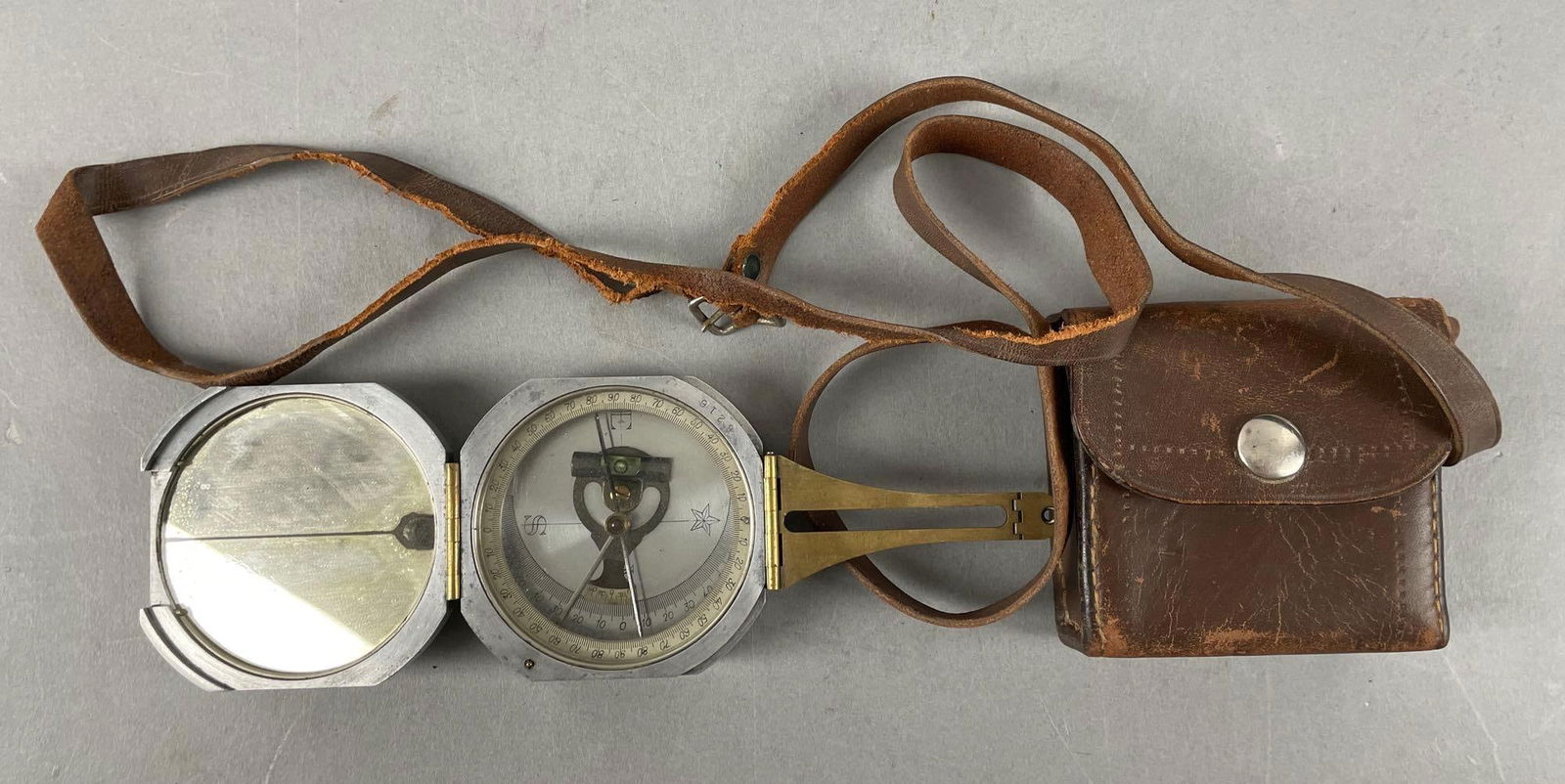 Antique D.W. Brunton's Pocket Transit: Leather case measures 3 1/4" x 3 1/4"