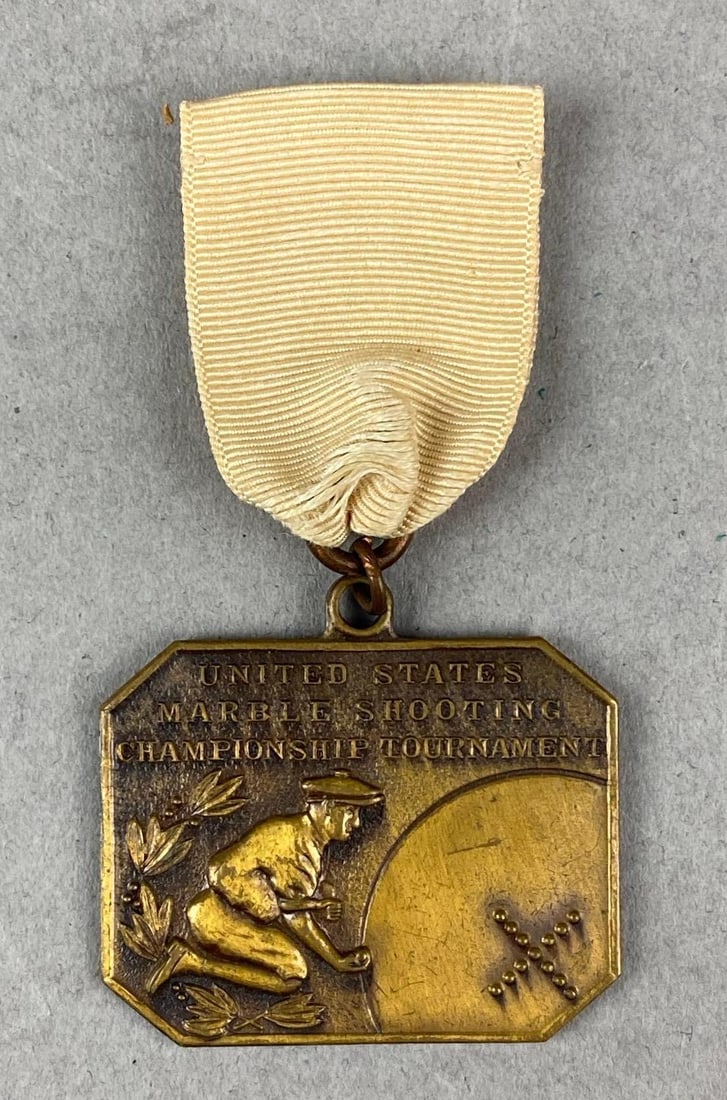 United States Marble Shooting Championship Tournament Medal: Youngstown, Telegraph. Measures H 2 3/4 x W 1 1/2 inches.