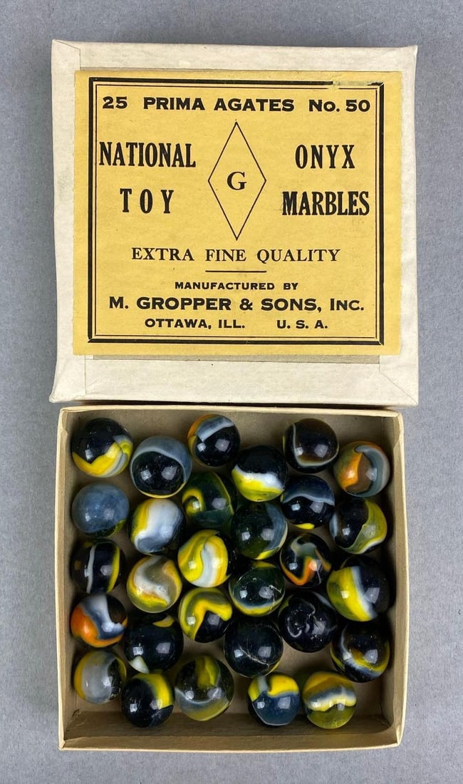 Vintage Box of National Toy Onyx Marble Prima Agates No.50 Marbles: M. gripper & Sons, Inc. Ottawa, Illinois. Box measures H 1 x W 4 x D 4 inches.
