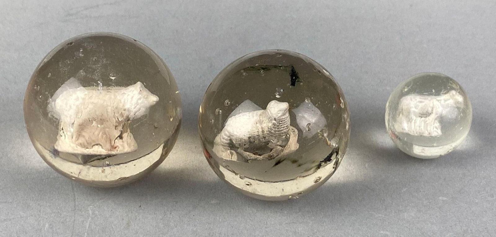 Group of 3 Sulfide Animal Glass Marbles: bruises throughout, largest measures 2.03”