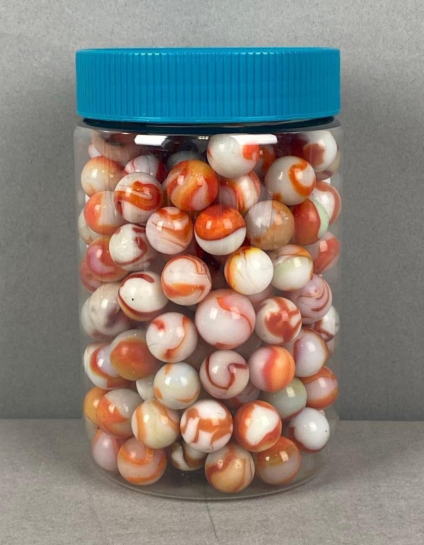 Group of Marbles: Container measures H 5 1/2 x W3 1/4 x D3 1/4 inches.