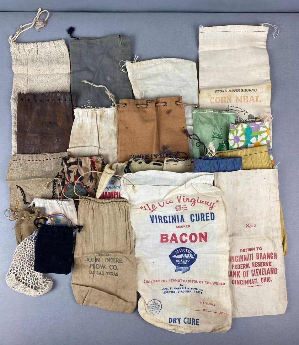 Large Group of Cinching Bag: Includes imperial champion marbles, Virginia Cured Bacon, John Deere Plow and more. Largest measures H 13 x W 6 inches.