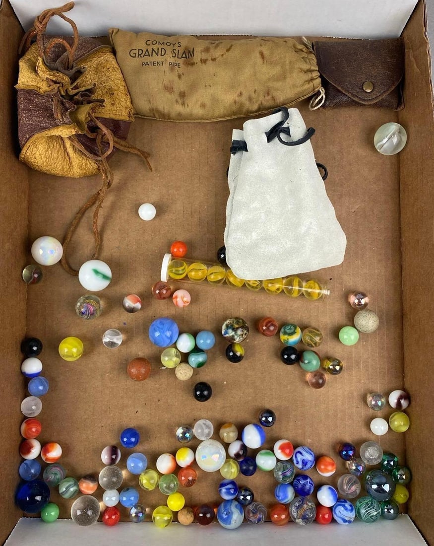 Group of Assorted Marbles and More: Includes shooters, marble pouch and marbles bag. Largest item measures H 3 x W 4 1/2 X D 4 1/2 inches.