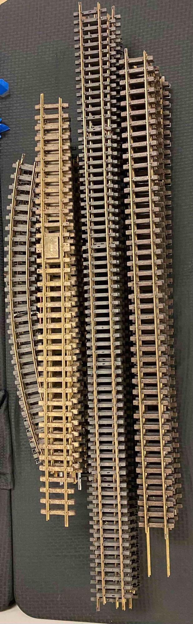 Group of Approximately 39 G Scale Straight/Curve Tracks: Metal and Plastic construction. Longest Tracks measure L 59 x W 3 1/2 inches. Recommend Third party Shipping.