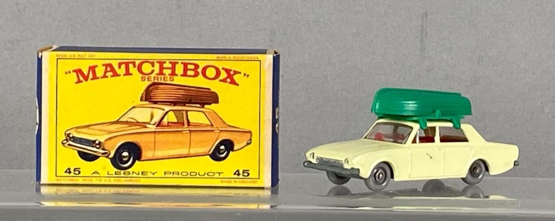 Matchbox No. 45 Ford Corsair With Boat: A Lesney Product, With original box, off white body, grey base, clear windows, grey plastic wheels, Die-Cast, Made in England.