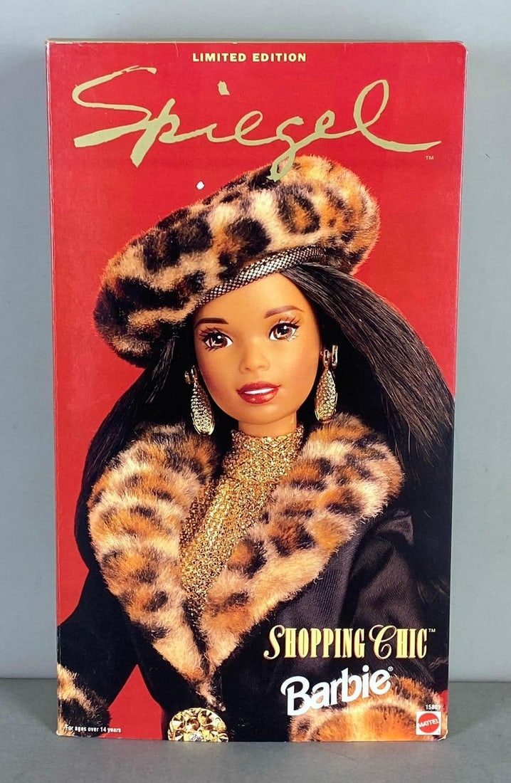 1995 Mattel Barbie Spiegel Shopping Chic Fashion Doll: Limited Edition Spiegel Barbie. New in original packaging. Measures 14 inches tall.