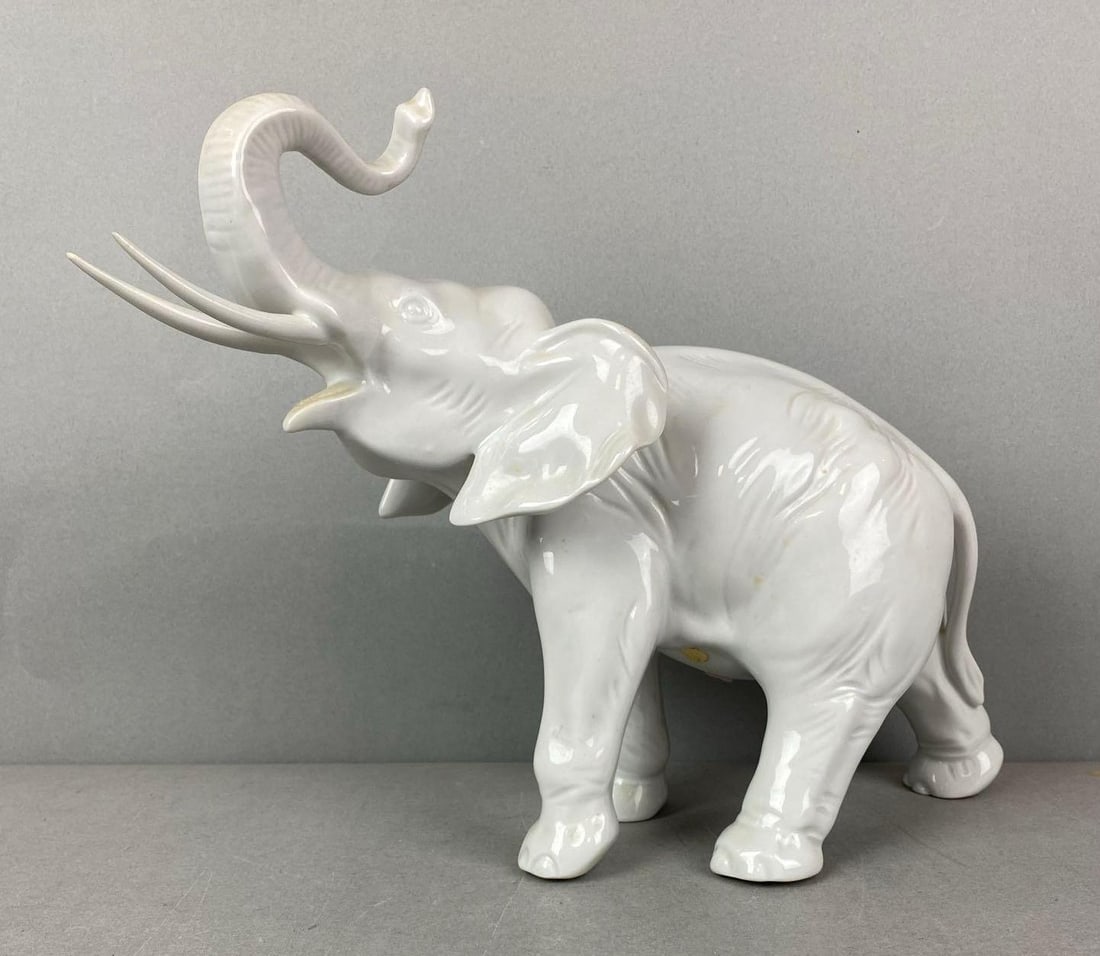 Vintage Royal Dux Porcelain Elephant Figure: Needs a good Cleaning. Measures H 9 3/4 x W 6 1/3 X D 13 1/2 inches.
