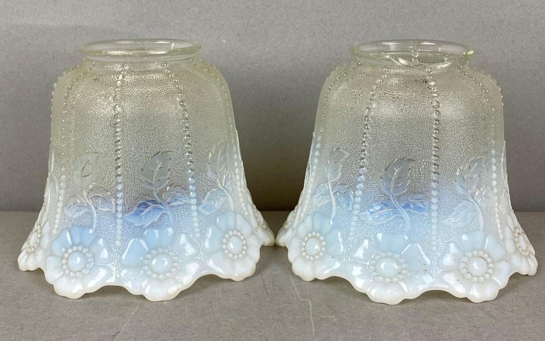 Group of 2 Antique Clear to Opalescent Light Shades: One fitter has a large chip. Fitter measures 2 1/4 inches. Largest shade measures H 4 1/2 x W 4 3/4x D 4 3/4 inches.