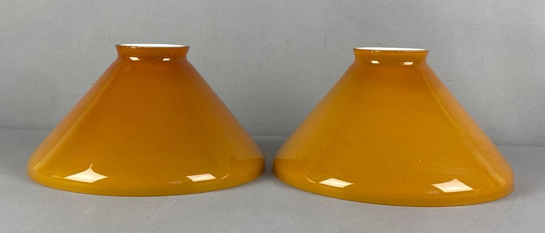 Group of 2 Antique Amber Cased Glass Lamp Shades: Each measures 5 1/2” H x 9 1/2” W with a 9” Fitter