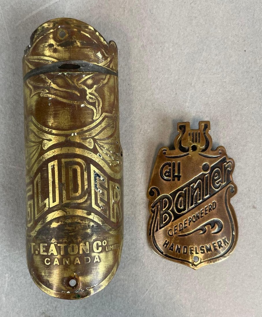 Group of 2 Antique Brass Bicycle Head Badges: Includes T. Eaton Glider, Banier, larger measures 3 1/2"