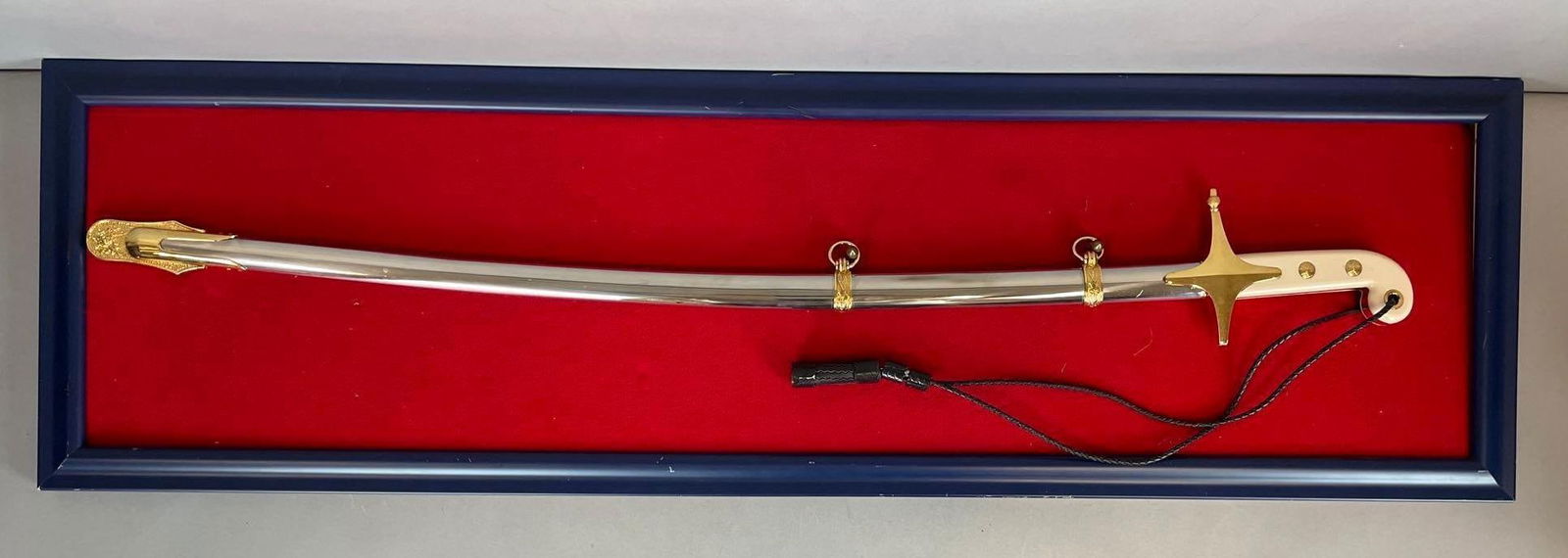 U.S. Marine Corps Officers Dress Sword and Scabbard: Possibly Vietnam era. WKC German stainless steel, 29 1/2" blade, display measures 12 1/2" x 42 1/4"