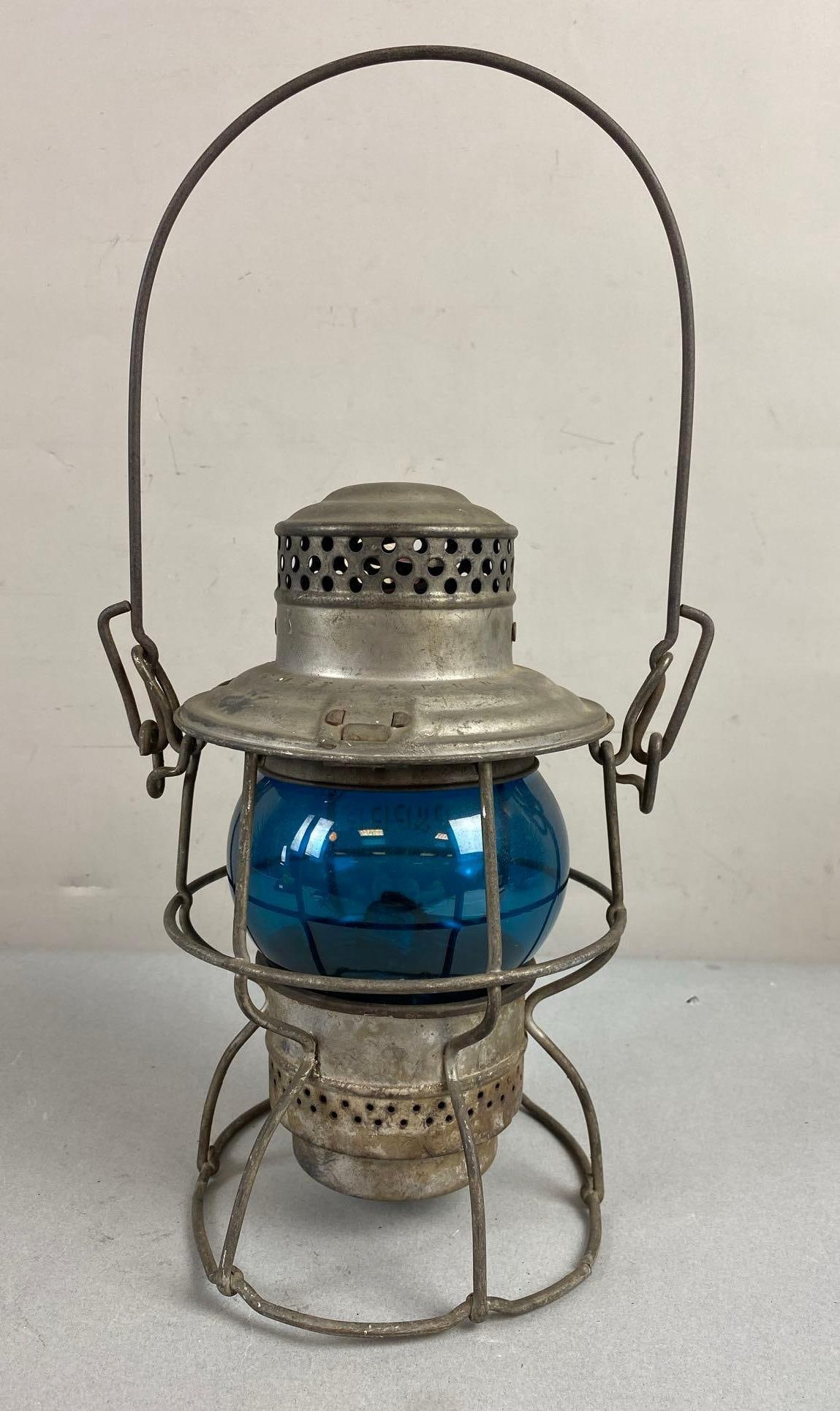 Vintage Adams Westlake Co. Kerosene Oil Lantern: C.M. St Paul Pacific R. R. Etched on blue globe. Unknown date. Measure 9 1/2 inches tall.