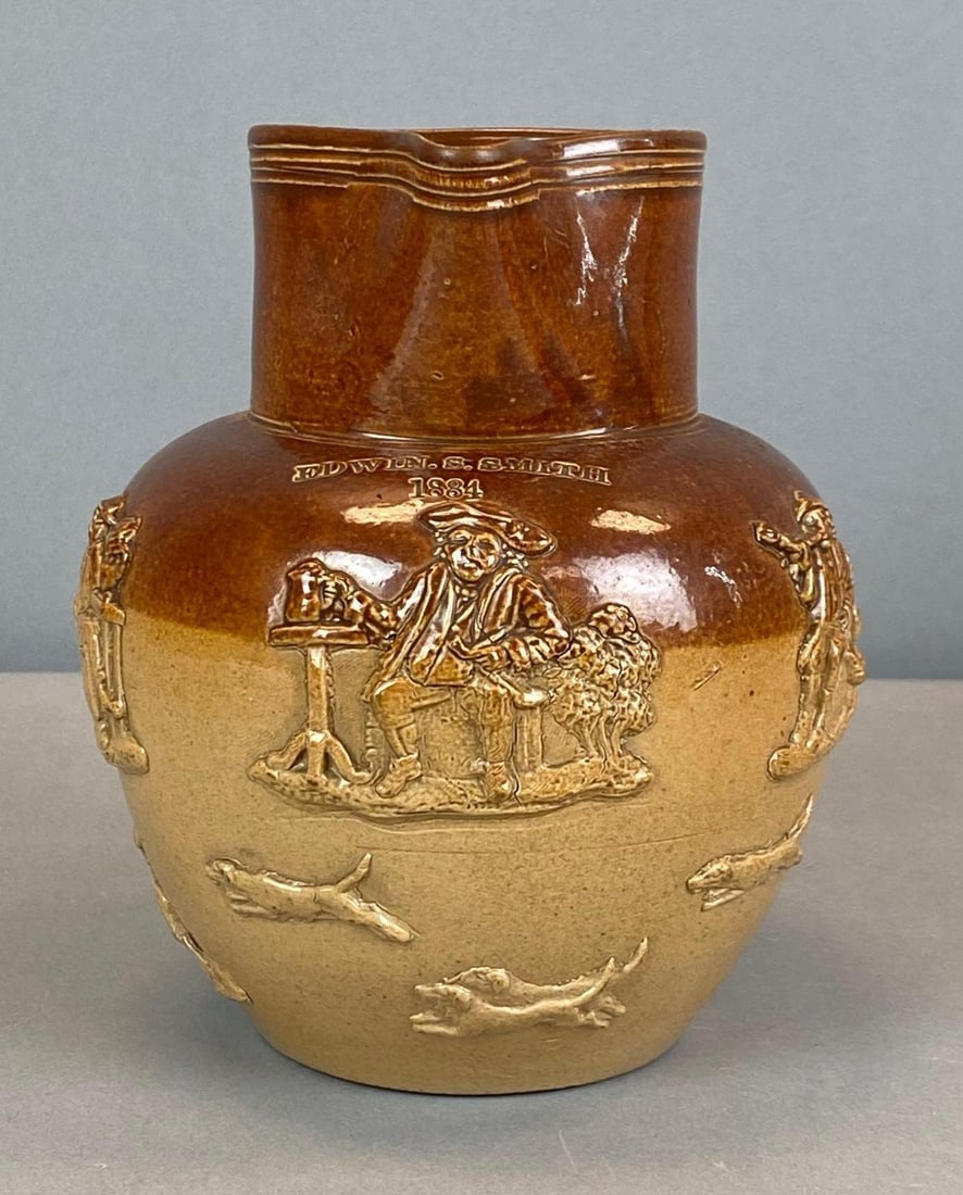 1884 Edwin S Smith Figural Relief Stoneware Pitcher: Measures 6 1/2” H x 6 1/2” W x 5” D