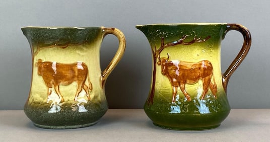 Group of 2 Antique Bull In Prairie Pottery Pitchers