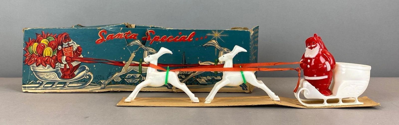 Vintage E Rosen Santa Special Plastic Candy Container Display: Features donner and blitzen, box severely damaged, box measures 4 1/2” H x 16” W x 2 1/2” D