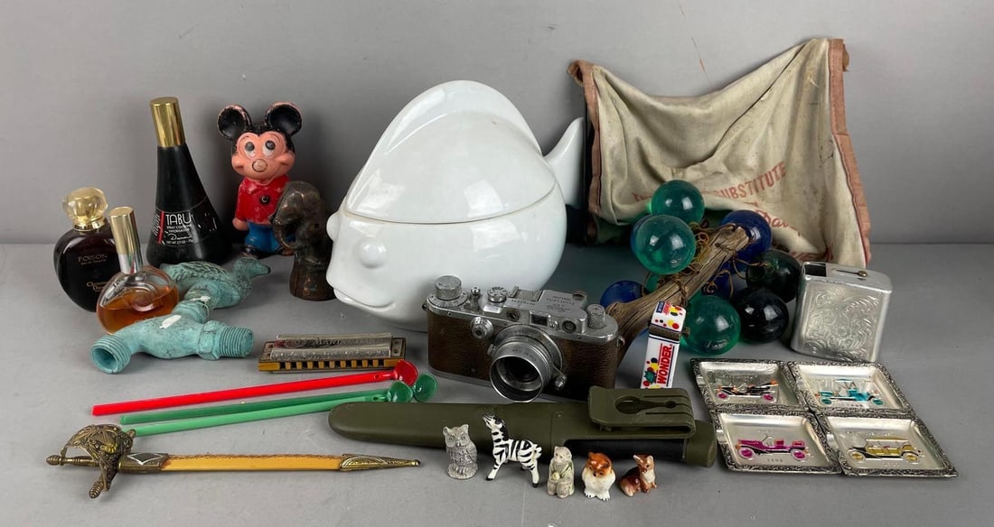 Group of Assorted Items: Includes perfumes, vintage leica camera, morakniv knife, fish jar measures 7 1/2" x 11" x 7"