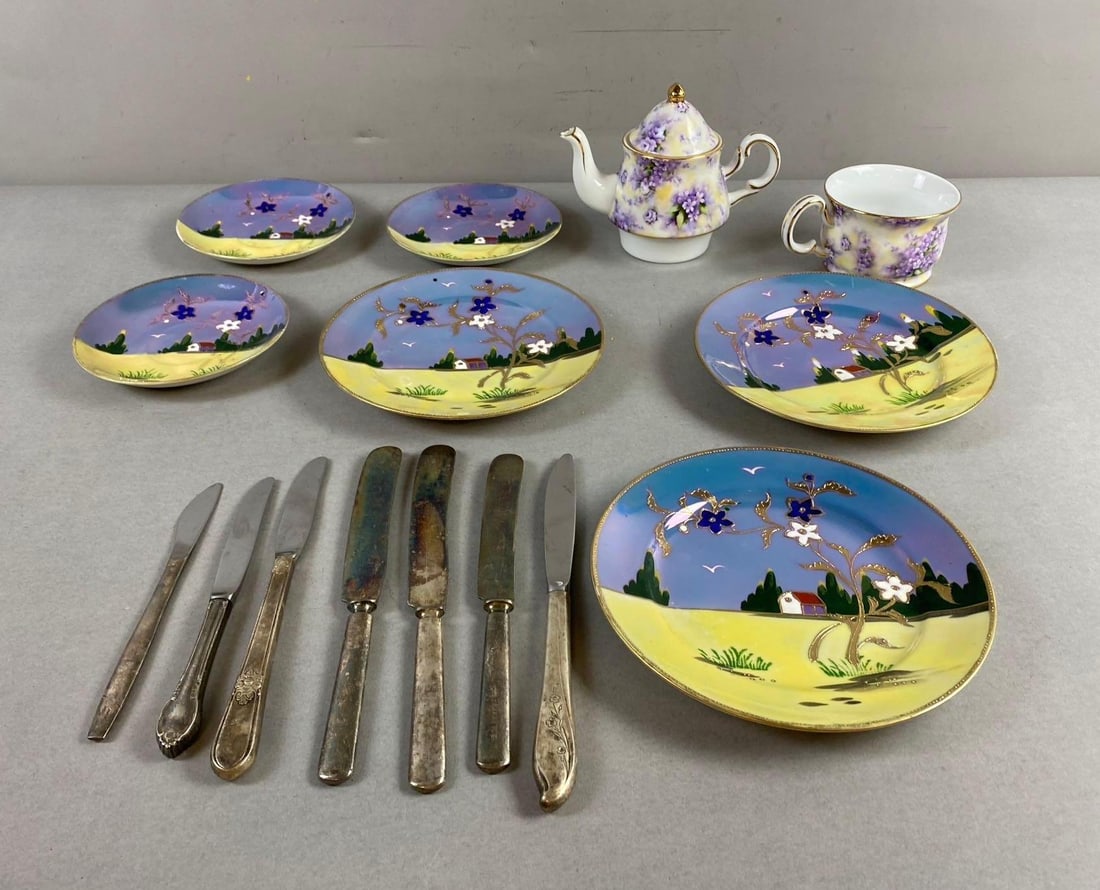 Group of 15 Assorted China Plates and More: Includes Silver plated butter knives, hand painted in Japan Plates, and more. Large item measures 7 inches in diameter.