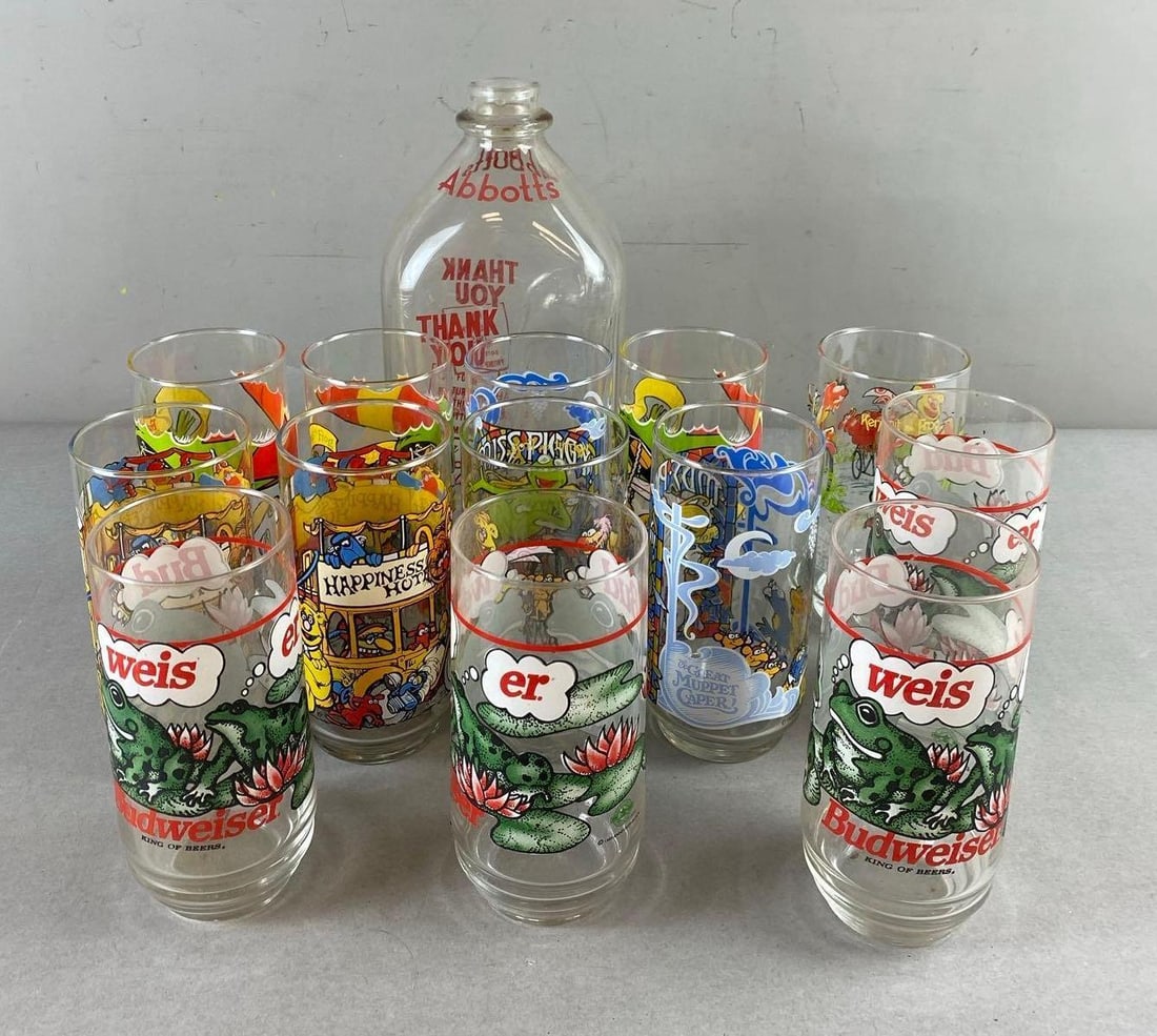 Group of 14 McDonald’s The Great Muppet Caper Drinking Glasses and More: Include Budweiser, milk bottle, and more. Tallest item measures 10 inches.