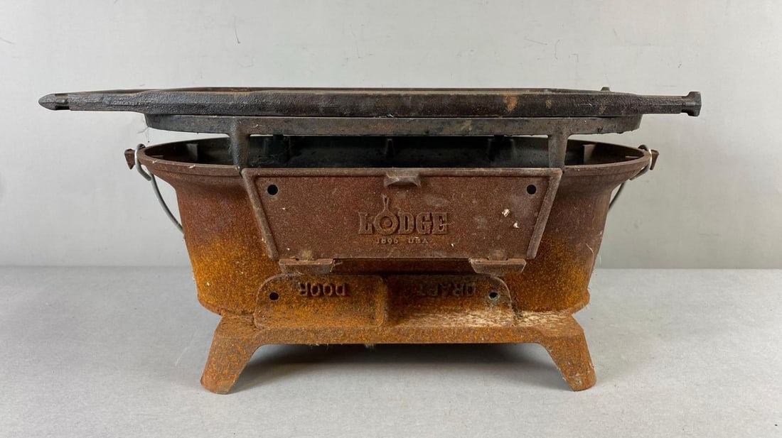 Iron Sporsman Pro Lodge Hibachi Style Cast Iron Grill: Comes with Grill plate and Griddle plate. Heavily Rusted throughout. Measures H 7 x W 10 x L 19 inches.