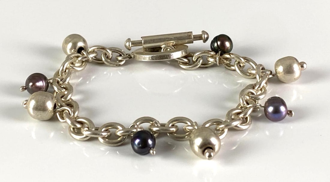 Sterling Silver Ball Charm Bracelet: In-House Shipping Option: If you would like to use our in-house shipping service, please select “Arrange My Own Shipping” when paying your invoice. After payment, our in-house shipping team