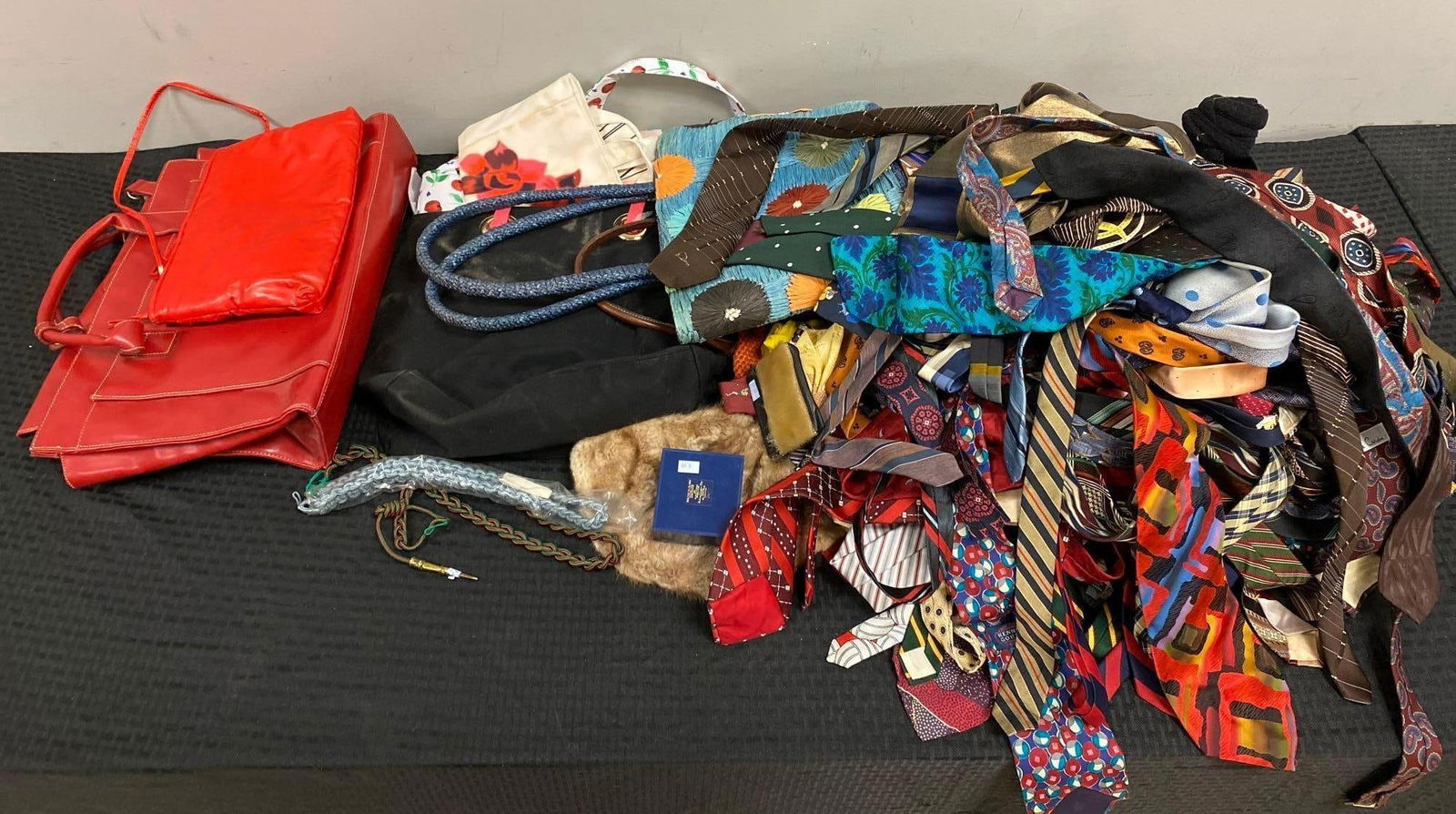 Group of Assorted Ties and Purses: In-House Shipping Option: If you would like to use our in-house shipping service, please select “Arrange My Own Shipping” when paying your invoice. After payment, our in-house shipping team wi