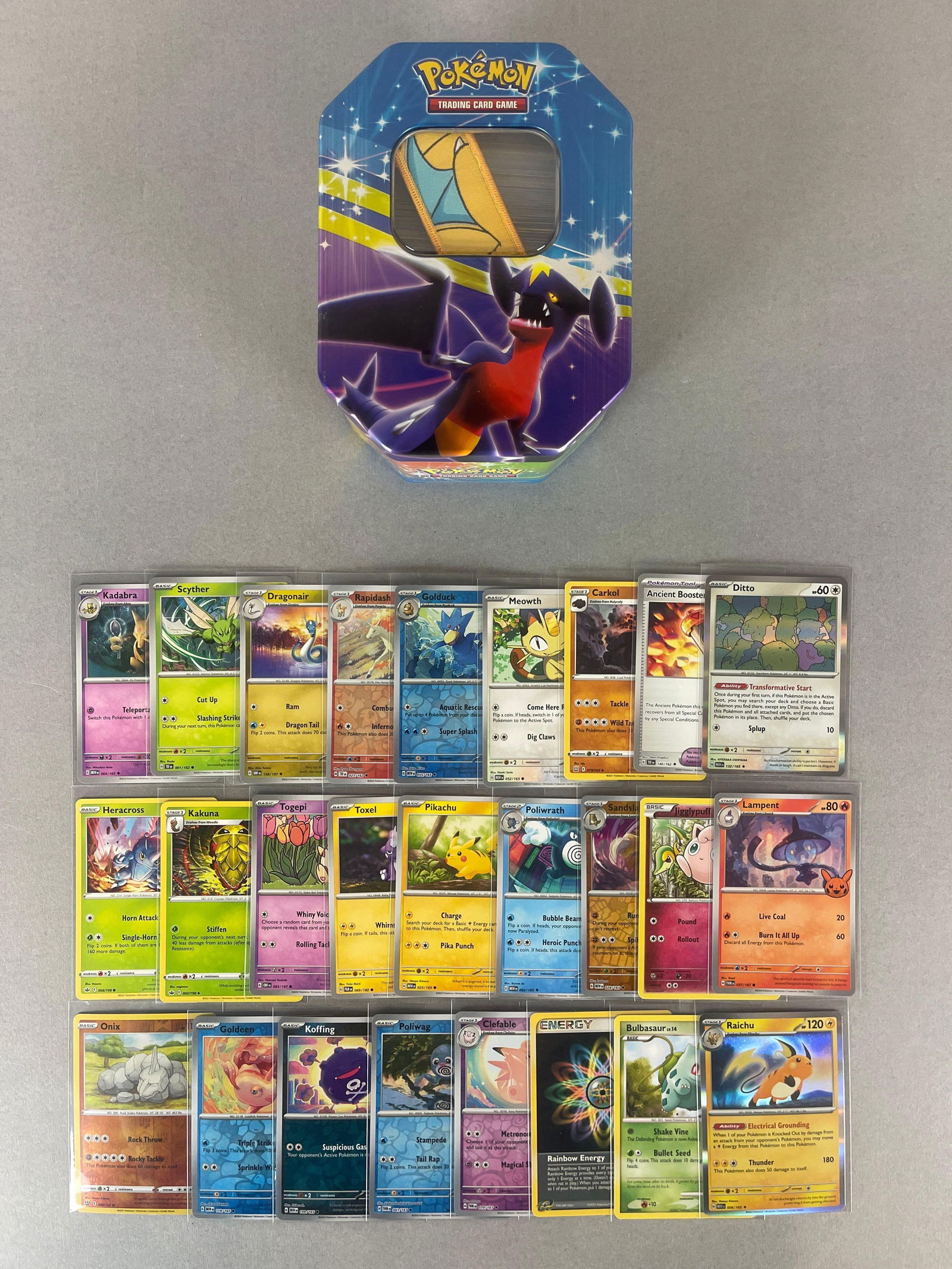 250+ 1999 - 2024 Pokemon Cards with Holos and 2009 Pokemon Platinum Fall Garchomp Lv X Collector Tin: Includes Collector tin, Dragonite keychain, Rapidash, Goldeen, Onix, Sandslash reverse holos, Meowth, Kadabra, Scyther, Draginair, and Much More