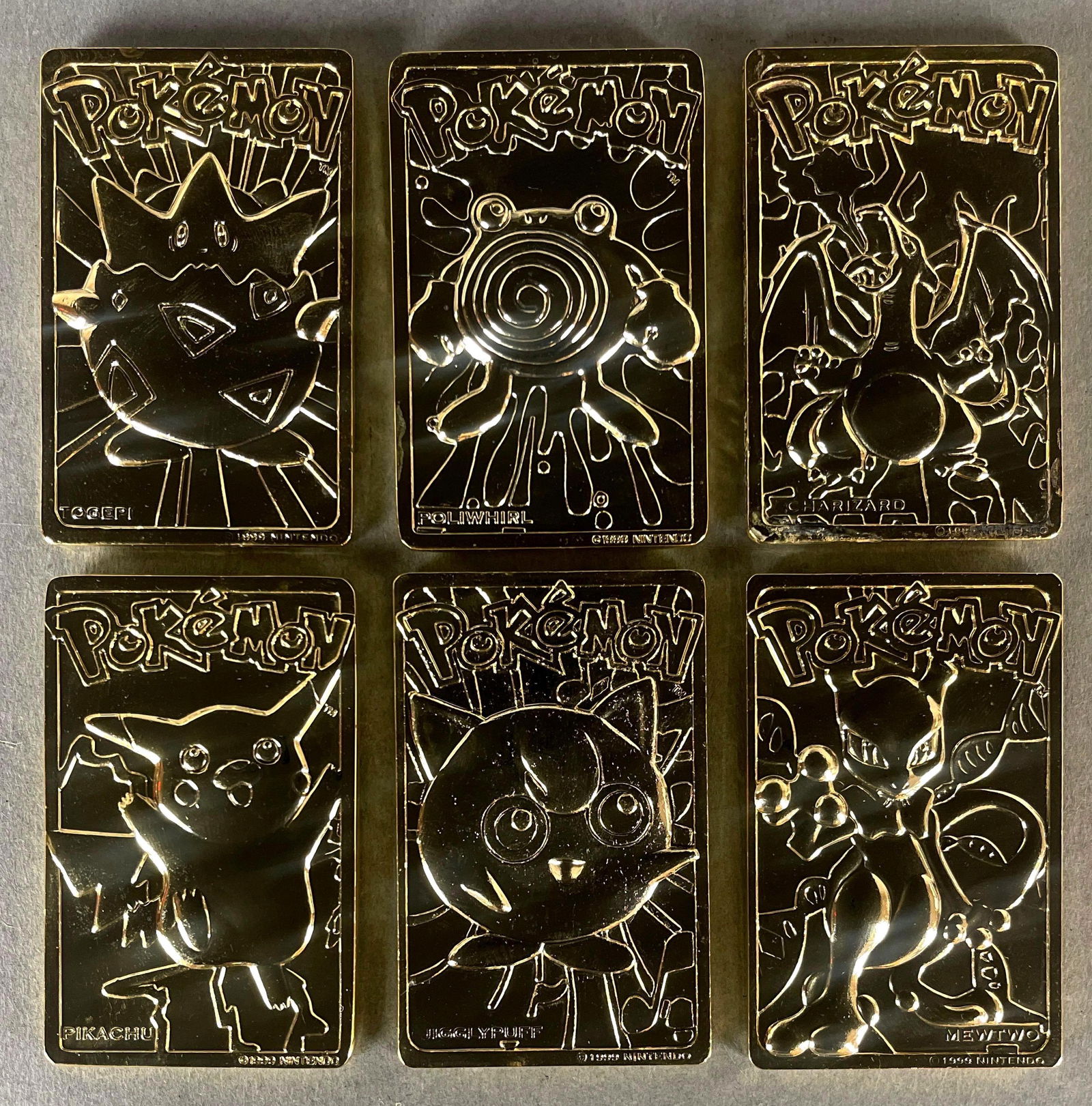 1999 Pokemon Burger King 23kt Gold Plated Cards, Set of 6: Includes, Charizard, Poliwhirl, Mewtwo, and More, Includes cases with some wear, and Chaizard has water damage, Measures 1 3/4 x 2 3/4 Inches