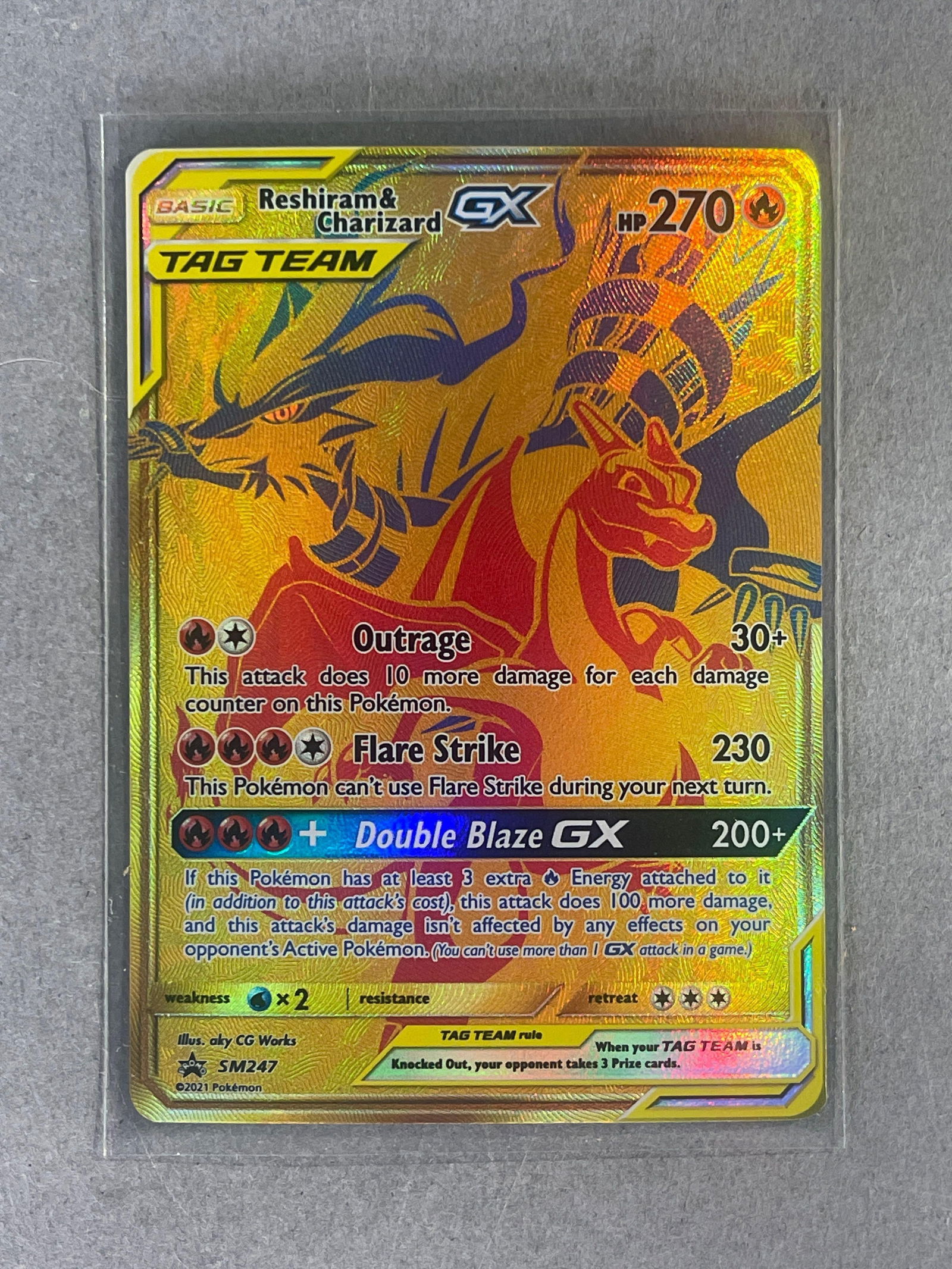 2021 Pokemon SM Black Star Gold Promo Reshiram and Charizard GX #SM247: 2021 Pokemon SM Black Star Gold Promo Reshiram and Charizard GX #SM247, Sharp card