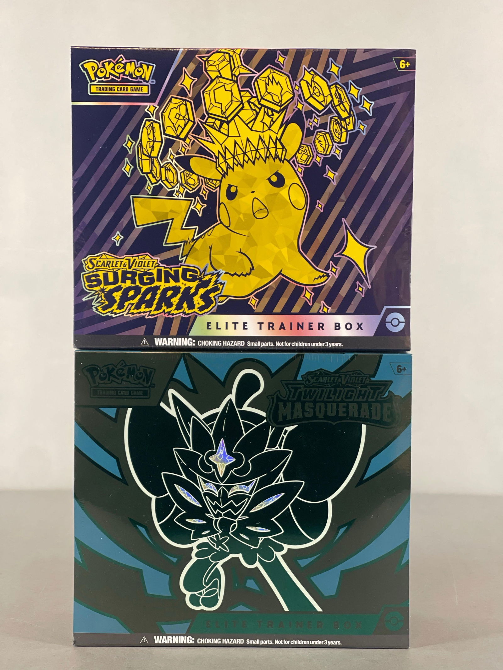 2 - 2024 Pokemon Scarlet and Violet Twilight Masquerade and Surging Sparks Elite Trainer Boxes: 9 - Booster packs per box